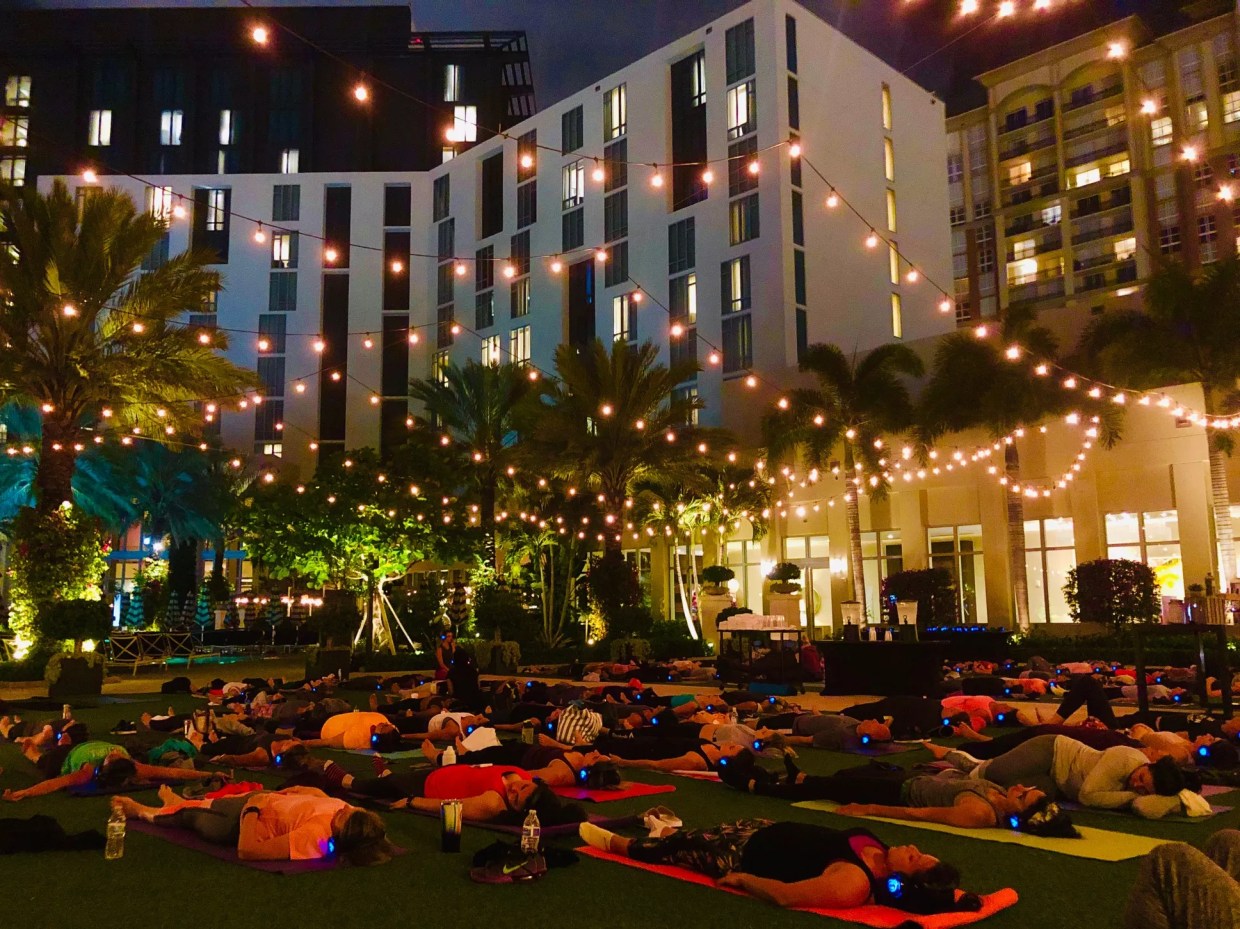 Glow Yoga, Beach Cleanups, and Blender Bikes: A Look Back at District Fit