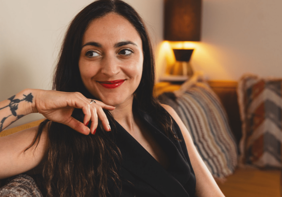 Headshot of a journalist smiling