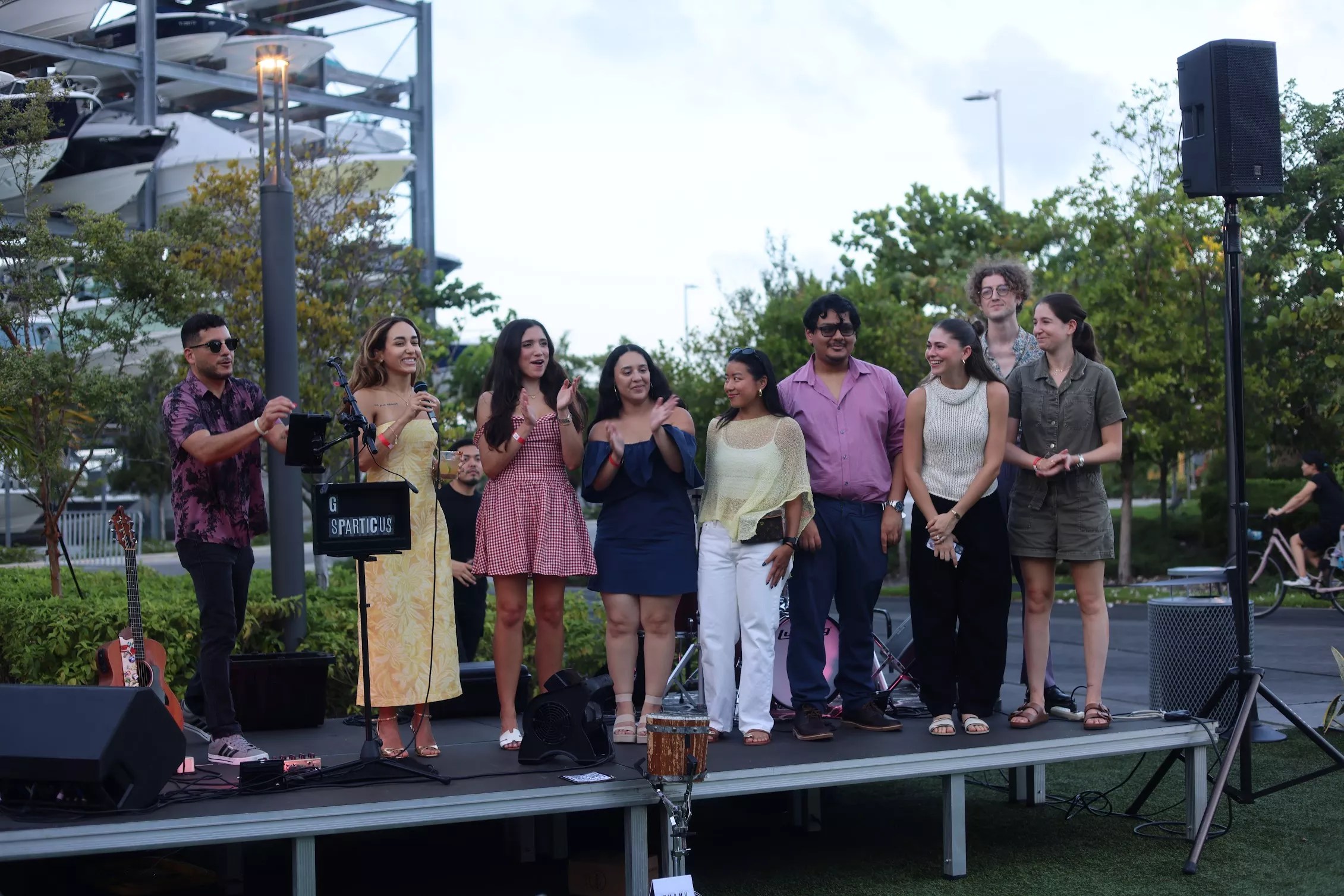 Journalists lined up on an elevated outdoor stage